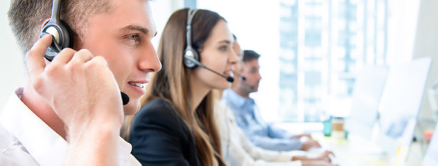 Male operator staff with team working call center