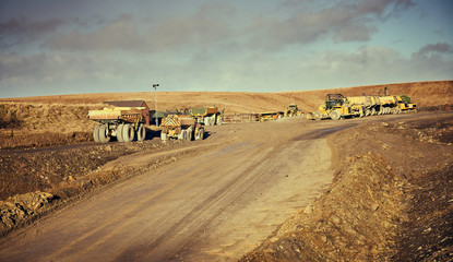 Fototapeta na wymiar Heavy plant machinery at the surface coal and fireclay mining site near Shotton in Northumberland.