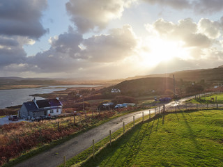 Views across Colbost and Loch Dunvegan at sunrise on the Isle of Skye in the Scottish Highlands.