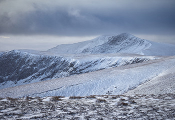 A frozen, snow and ice covered Blencathra from the summit of Bowscale Fell in the Lake District