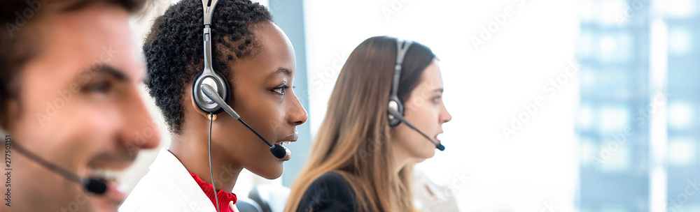 Wall mural Group of diverse telemarketing team in call center office banner background