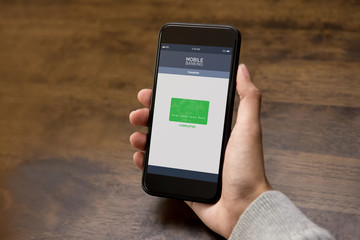 Woman transferred money online via electronic internet banking application on smartphone