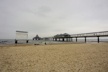 Fototapeta premium F, Germany - November 2018: The Pier On The Beach With The Big Screen