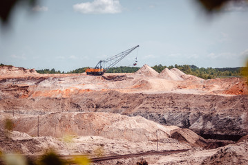 Coal mining at an open pit in the daytime