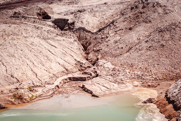 Coal mining at an open pit in the daytime