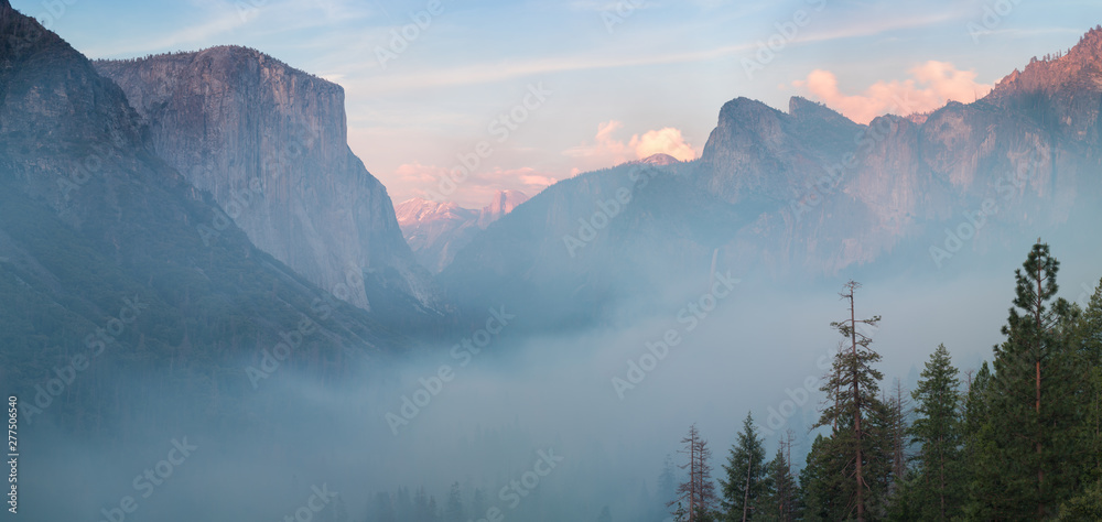 Wall mural classic tunnel view of scenic yosemite valley with famous el capitan and half dome rock climbing sum