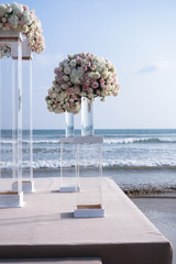 Beautiful bouquets of roses on the beach, ocean. Registrations of a wedding, holiday. background romantic background in a tropical country