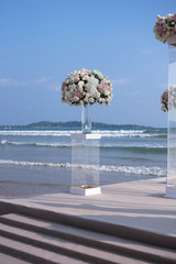 Beautiful bouquets of roses on the beach, ocean. Registrations of a wedding, holiday. background romantic background in a tropical country