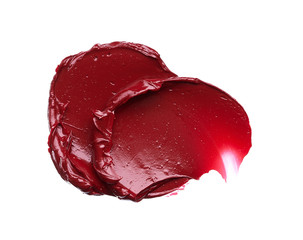 Smear and texture of red lipstick or acrylic paint isolated on white background.