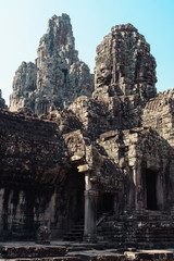 Fototapeta premium Faces of Bayon temple in Angkor Thom, Siemreap, Cambodia. The Prasat Bayon is a richly decorated Khmer temple at Angkor , ancient architecture in Cambodia