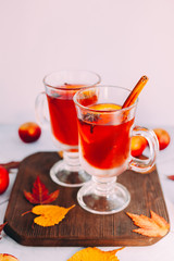  Hot red mulled wine with orange slice, anise and cinnamon sticks. 