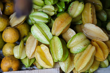 Carambola oriental fruit on the Asian market. Vegetarian theme. Stock photo