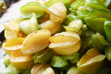 Carambola oriental fruit on the Asian market. Vegetarian theme. Stock photo