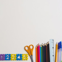 Figures near school supplies