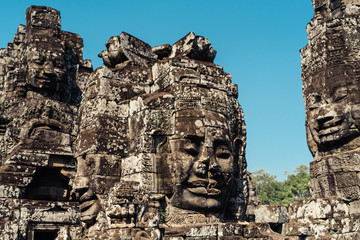 Fototapeta na wymiar Faces of Bayon temple in Angkor Thom, Siemreap, Cambodia. The Prasat Bayon is a richly decorated Khmer temple at Angkor , ancient architecture in Cambodia