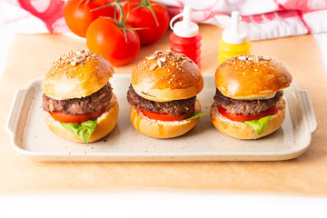 Food concept Homemade beefs hamburgers serve on square plate on white background with copy space