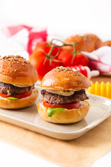 Food concept Homemade beefs hamburgers serve on square plate on white background with copy space