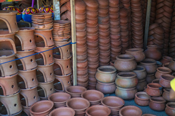 Ceramic pots on the Eastern market in Asia in which they make food or grow plants. Stock photo