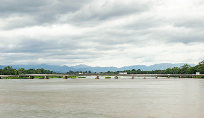Fototapeta na wymiar Long bridge cross the rivers in the north of Thailand