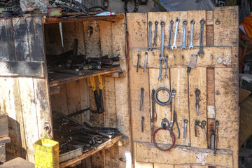 Different dirty tools in the box. The tools are old in the workshop. stock photophone