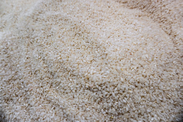 Different rice cereals in bags on the market or supermarket. Stock photo background