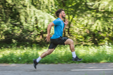 Athlete running in nature with motion blur 