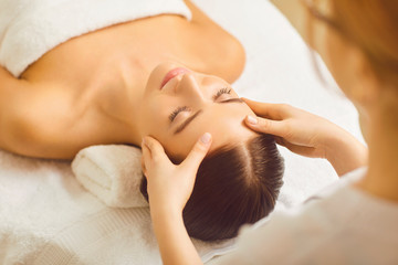 Fototapeta na wymiar Face woman massage close up in a beauty clinic.