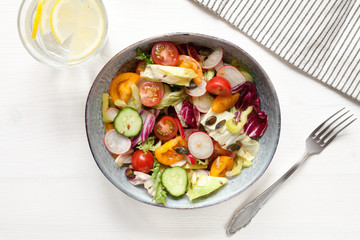 Vitamin salad with tomatos, greens, etc. Organic food concept. Healthy menu.