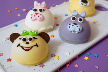 Cake in the form of little animals. Homebaked soufflé in the glaze is framed in the shape of animal muzzles