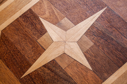 Vintage parquet with geometric star pattern