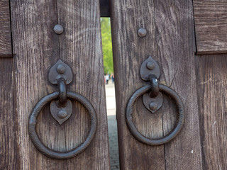 Old Wooden Gate with wrought iron rings   Solid oak old gate made of wood