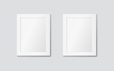 Two white frames on the wall. Vector mock up
