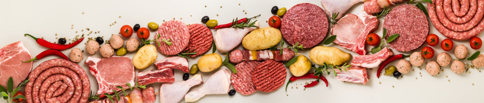 various types of italian raw meat with spices, vegetables and aromatic herbs. banner for supermarket or butcher