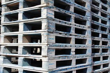 Detail of wooden pallets stocked at an industrial yard