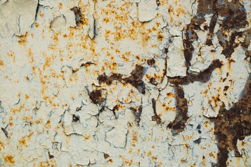 Old corroded metal wall background with flaky gray paint .Rusty flaky cracked metal surface.Abstract the surface texture of the old metal.
