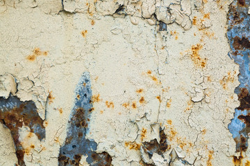 Old corroded metal wall background with flaky gray paint .Rusty flaky cracked metal surface.Abstract the surface texture of the old metal.