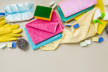 various detergents and the necessary attributes for cleaning, washing and ironing in the background. copy space