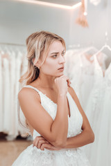 Beautiful young woman being deep in thought.