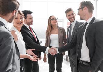 Business handshake in a modern office
