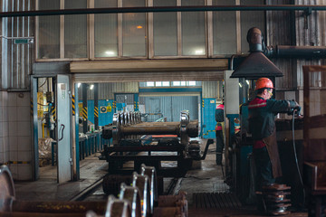 Plakat railway factory workers in the shop.