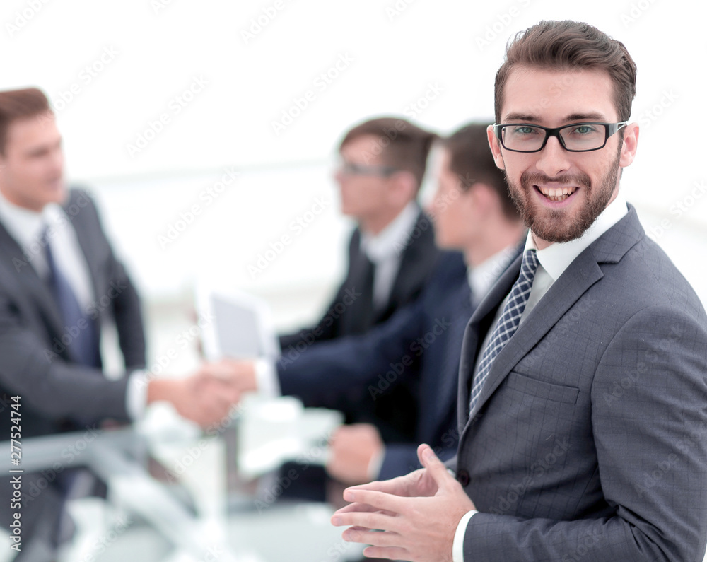 Canvas Prints smiling businessman on blurred office background