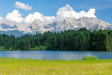 Alpine Lake and flowering meadow in Bavaria