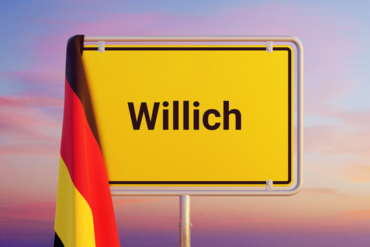 Willich. Gelbes Schild/Ortsschild. Flagge von Deutschland h&auml;ngt dar&uuml;ber. Himmel mit Sonnenuntergang oder Sonnenaufgang