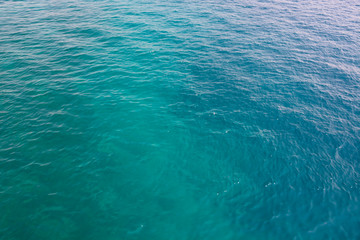 Fototapeta na wymiar Blue sea water blurred ripple background. Aegean Sea, Turkey