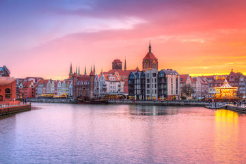 Naklejka na ściany i meble Amazing sunset in Gdansk reflected in Motlawa river, Poland.