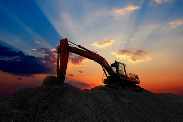 Silhouette excavator working on construction site. © Meaw_stocker