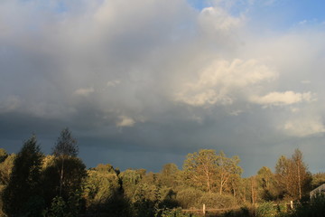 Obraz premium stormy sky in the autumn in the village
