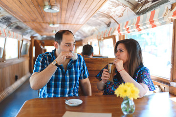 couple with drinks at cafe