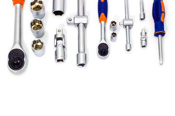 A set of tool heads for loosening screws, bolts and nuts. Ratchet screwdriver. White background