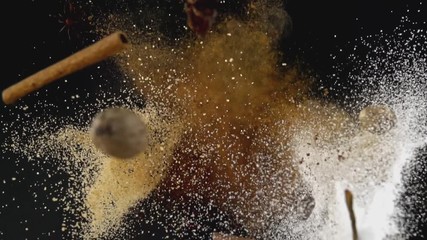 Christmas Exotic Spices in Flames Flying up and Falling down in Slow Motion - Powered by Adobe